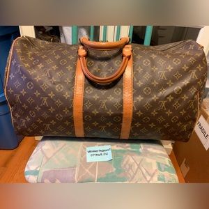 Authentic Louis Vuitton Keepall55 with strap